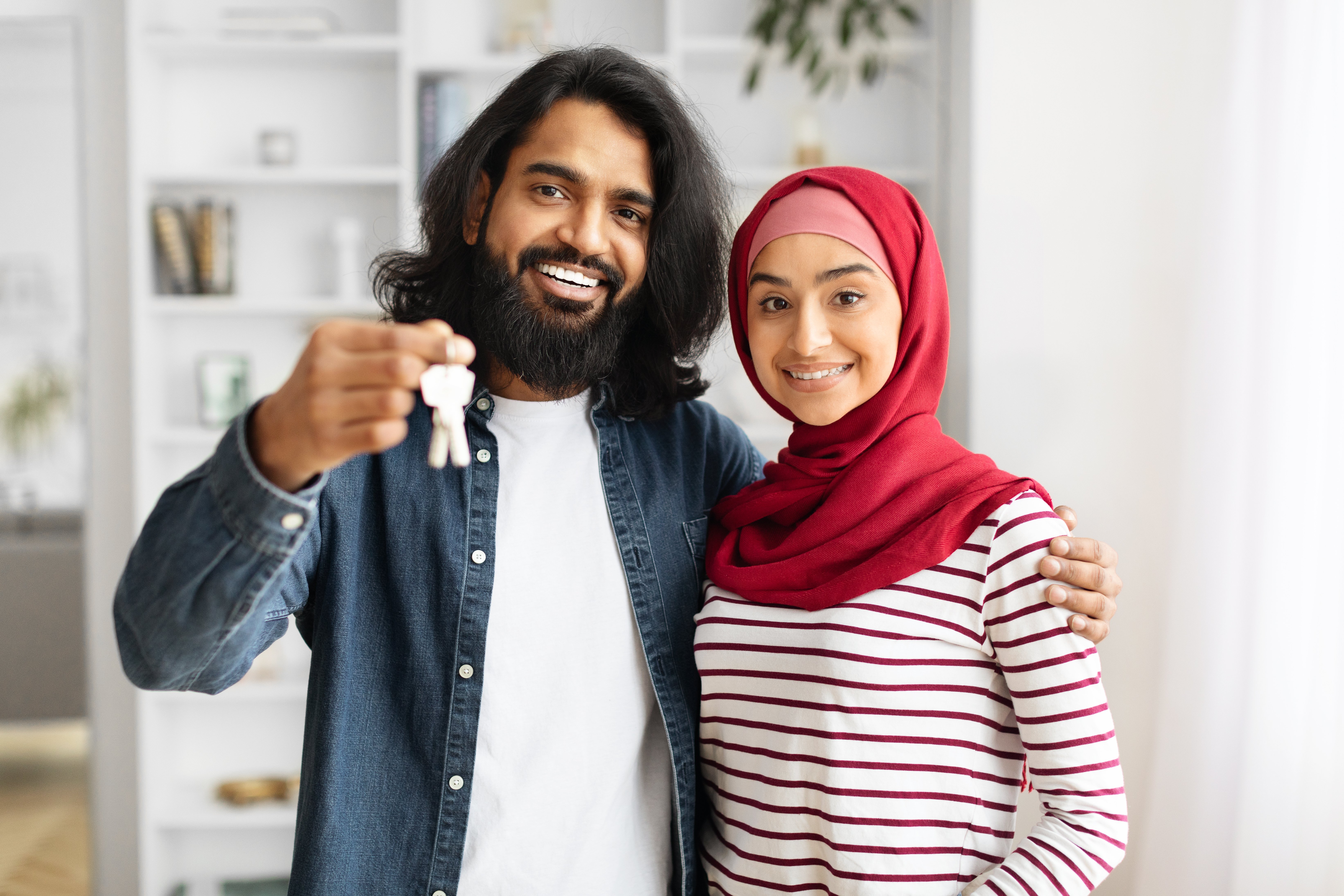 new-home-concept-happy-muslim-couple-holding-hous-2024-03-05-20-23-15-utc