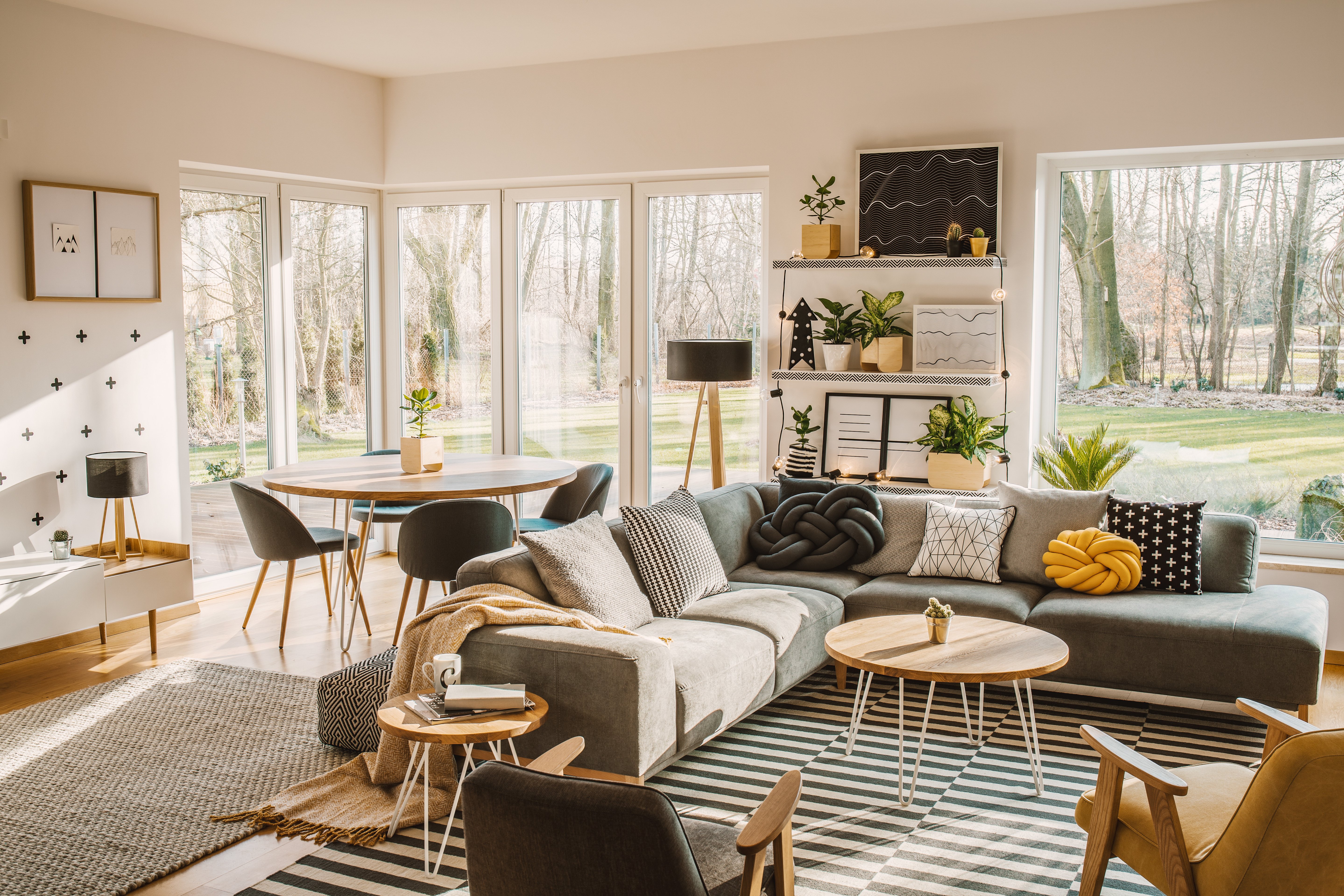 wooden-round-dining-table-in-the-corner-of-an-ope-2023-11-27-04-57-48-utc